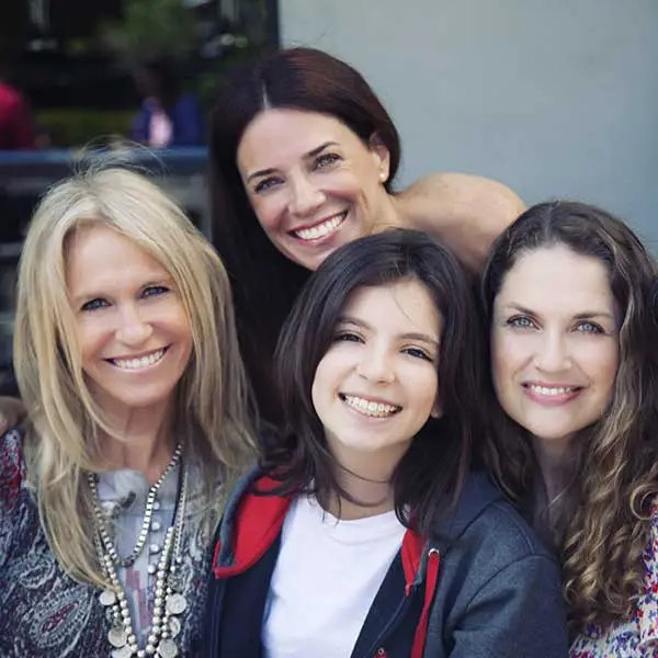 Diverse age group of women smiling and posing