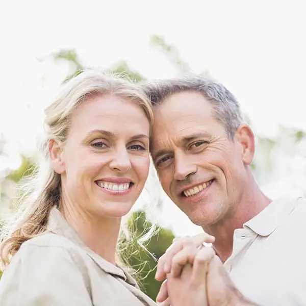 Older couple holding hands