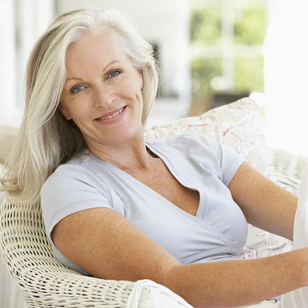 Mature woman sitting on her patio