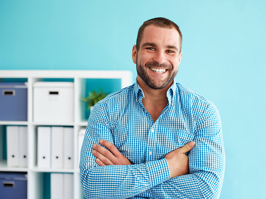 Young businessman with crossed arms